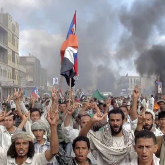 Protesters march during an anti-government demonstration in Radfan, a district in the southern Yemeni province of Lahej, on January 27, 2011.