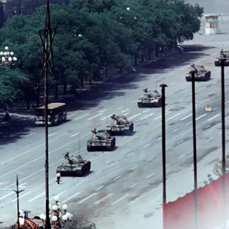 A man stands in front of a convoy of tanks in the Avenue of Eternal Peace in Tiananmen Square in Beijing, China on June 5, 1989.