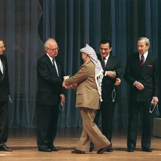 Arafat, president of Palestine Liberation Organization (PLO) shakes hands with Israeli Premier  Rabin at the signing of the Gaza-Jericho Agreement on May 4, 1994. 
