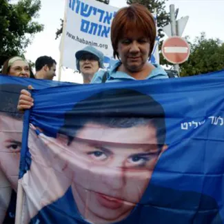 In 2008, people in Jerusalem attend a rally marking two years since Israeli soldier Gilad Shalit was captured by Palestinian militants.
