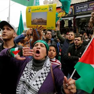 On December 29, 2017, people in Amman, Jordan protest U.S. President Donald Trump's recognition of Jerusalem as Israel's capital.